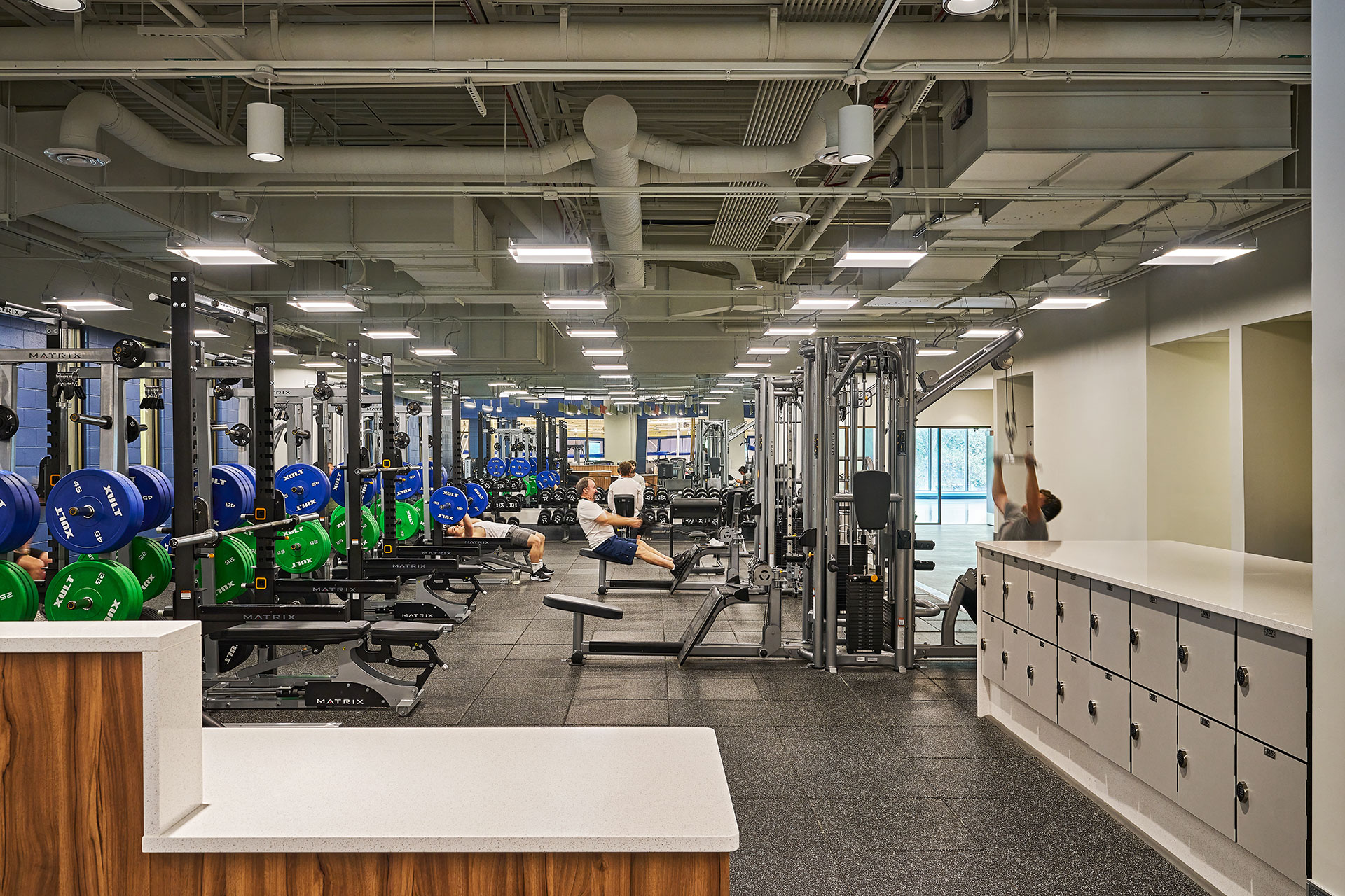 workout space with mirrors on the perimeter and lockers for member storage