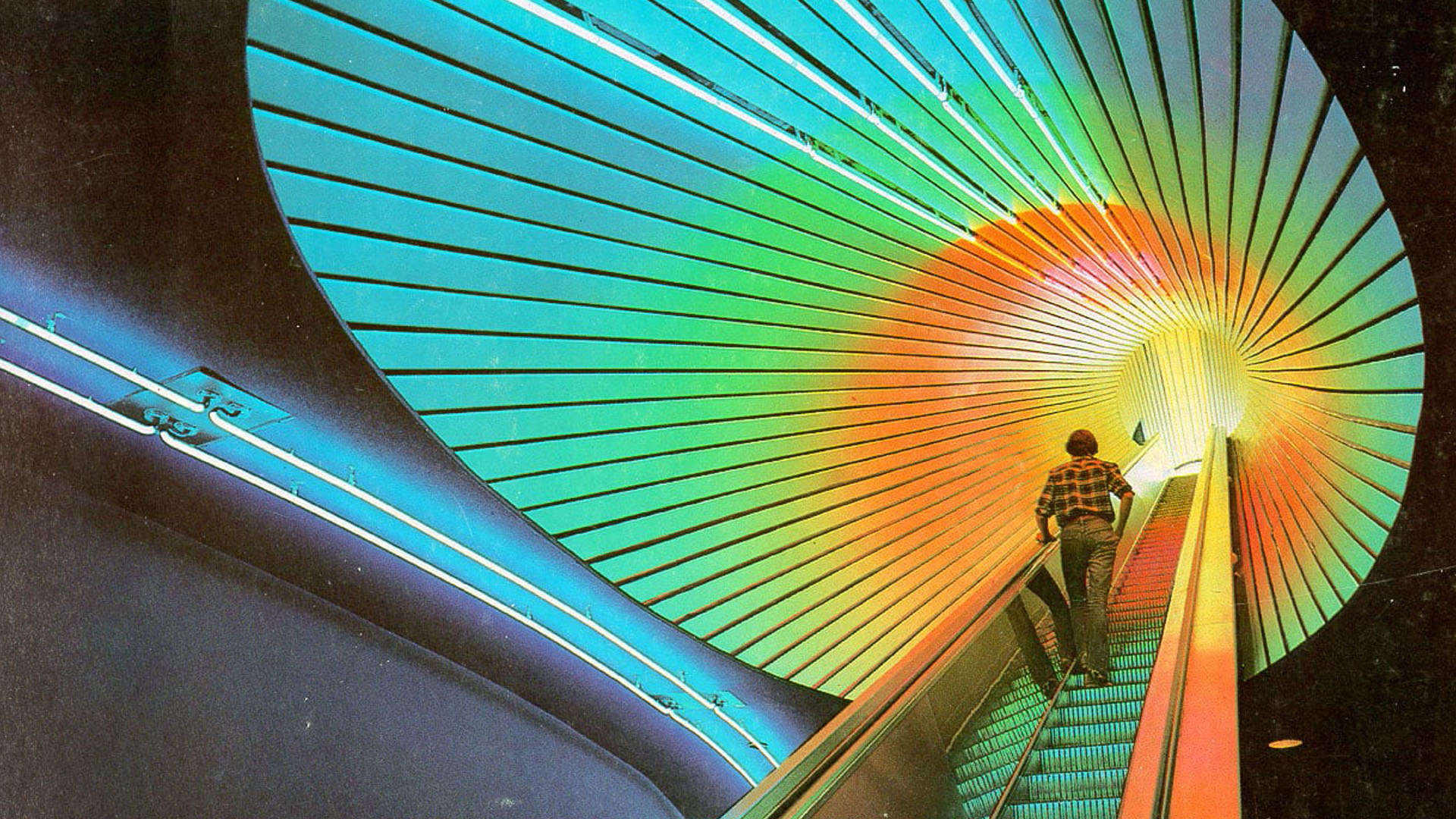 escalator surrounded by neon lighting